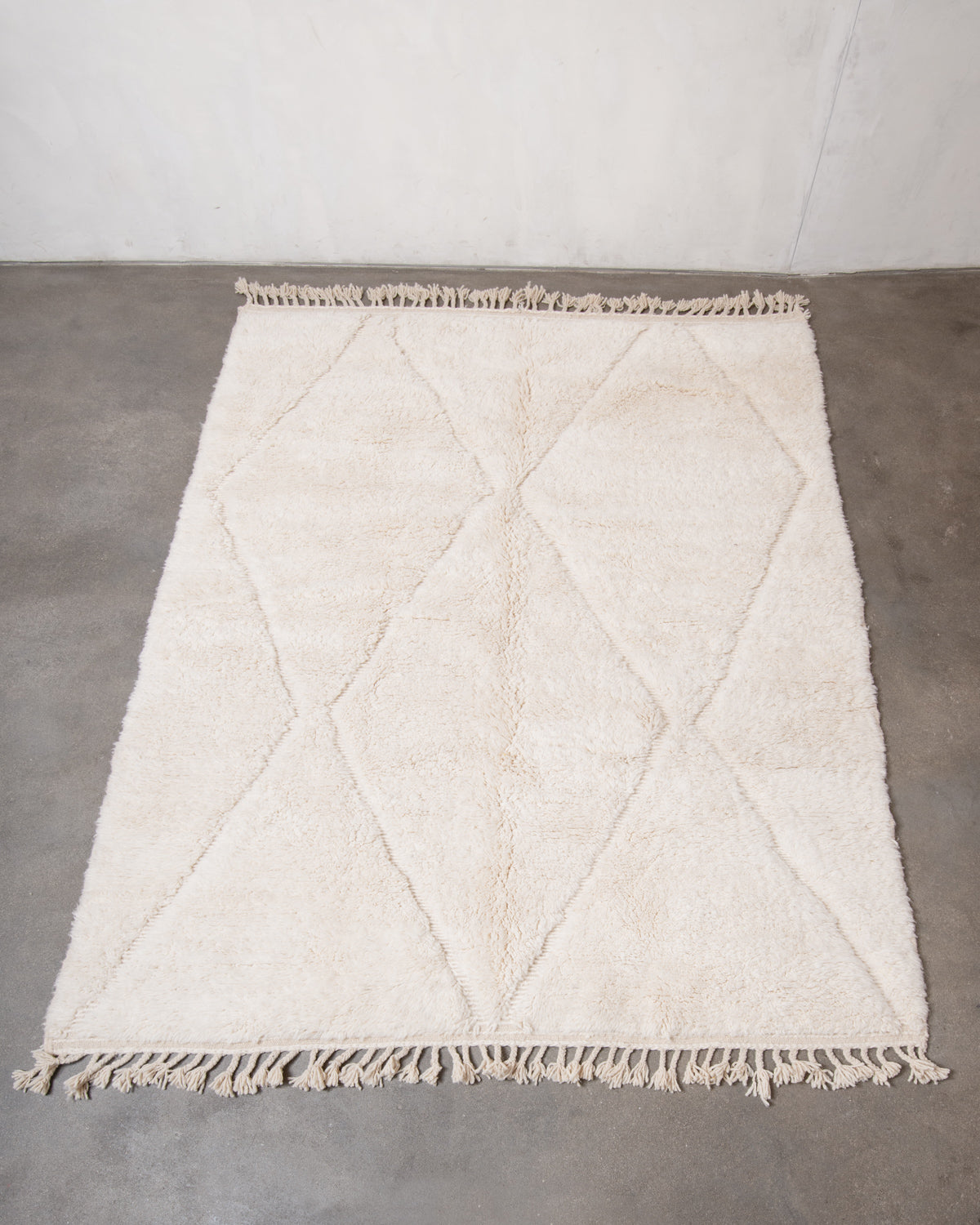 Modern, designer, handcrafted Berber rug from Morocco. Beniourain carpet with minimalist design, natural wool pile and a fluffy texture.